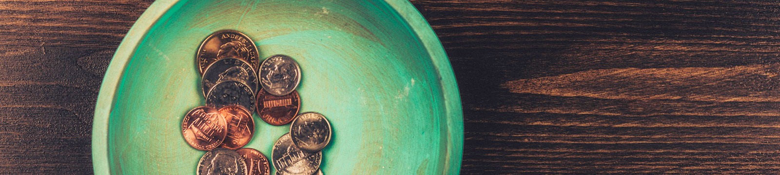 a small round tray full of coins